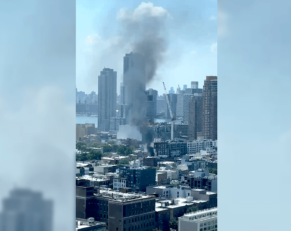 A plume of smoke rose over Long Island City during the fire