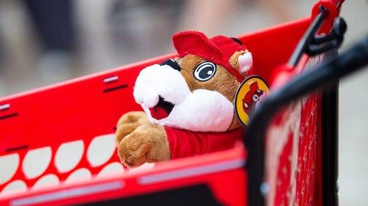 A plush Buc-ee's beaver peeks out from a shopping cart during the grand opening of Buc-ee's in Sevierville on Monday, June 26, 2023
