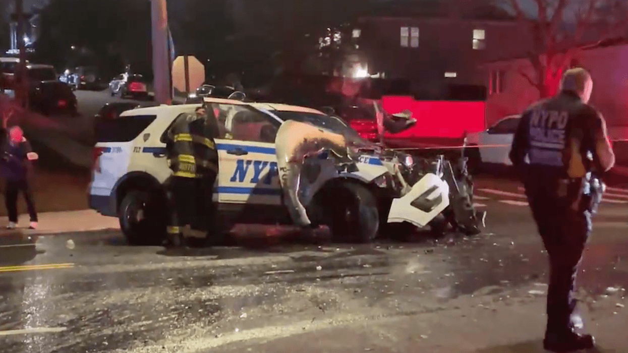 A police car crashed into a black SUV in Staten Island on Saturday in a multi-car collision that injured two officers and seven others.