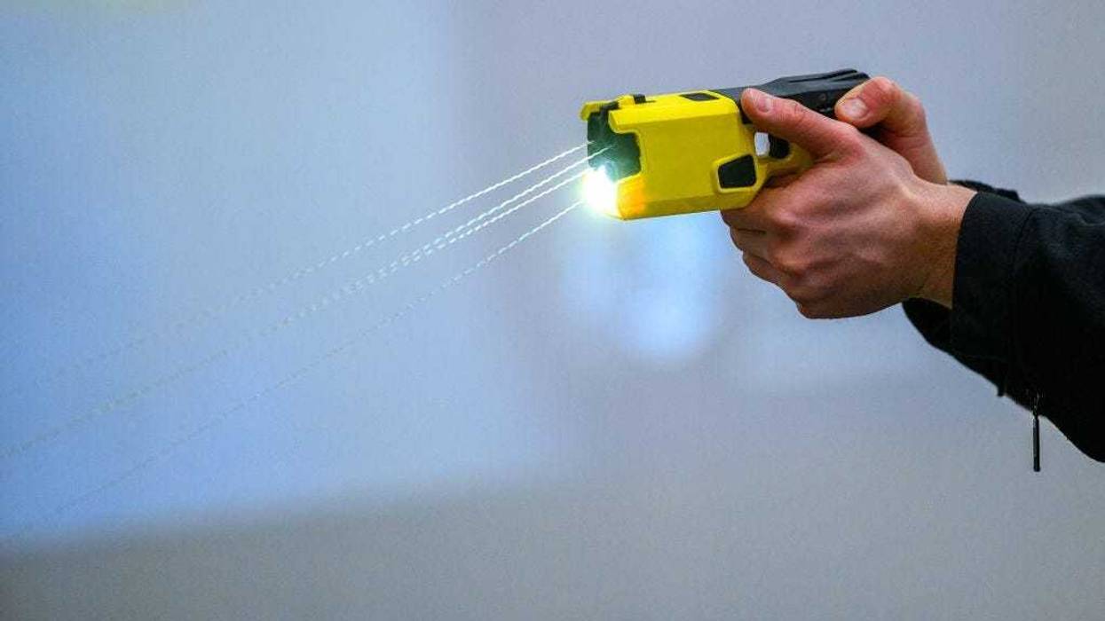 A police officer demonstrates the handling of an Taser on January 15, 2021 in Dortmund, Germany. Police in North Rhine-Westphalia will begin using the Axon Taser 7 electroshock devices in a two-year pilot project, after which authorities will assess whether the devices will become standard issue.
