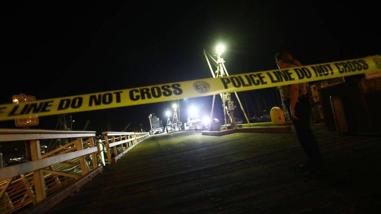 A police officer keeps watch on a pier where deceased victims from the sunken diving ship Conception were taken ashore on September 3, 2019 in Santa Barbara, California.
