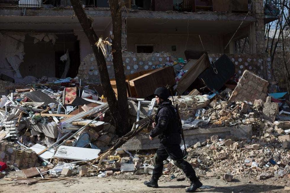A police officer patrolls a residential area which was destroyed as a result of a rocket strike two weeks ago on March 28, 2022 in Kyiv, Ukraine. Ukraine