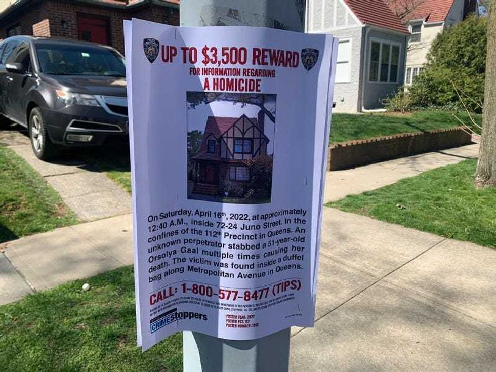 A police reward poster in the neighborhood on Wednesday
