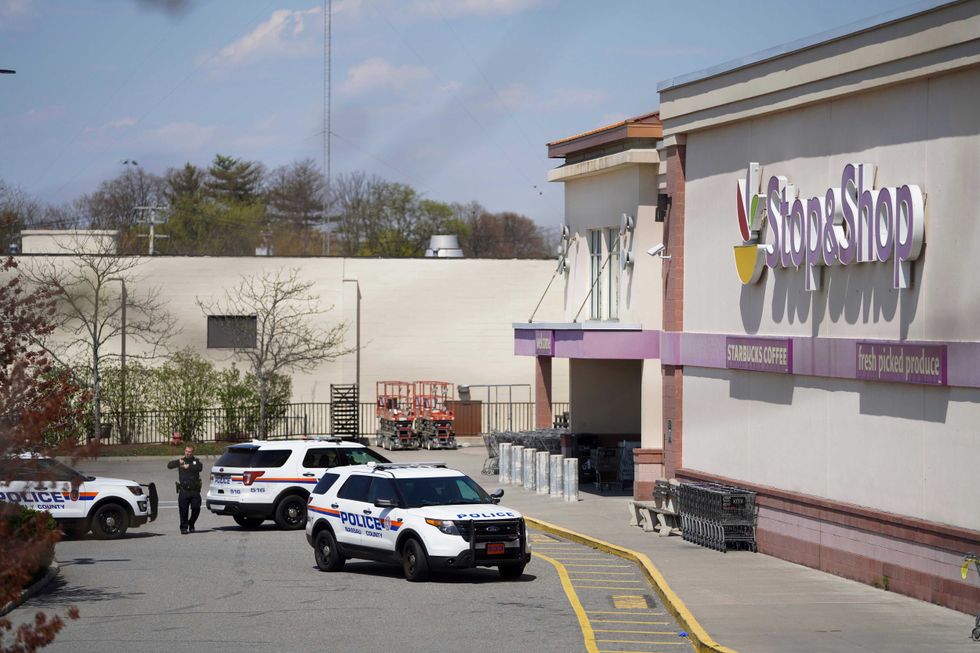 A policeman is seen outside a Stop & Shop grocery store where a shooting took place in West Hempstead, New York, the United States, on April 20, 2021.