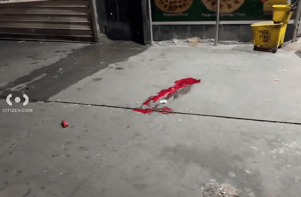 A pool of blood was on the sidewalk outside a smoke shop in Downtown Brooklyn where a man was critically injured in a stabbing on Wednesday night
