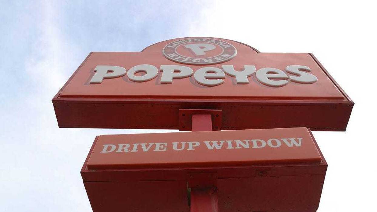 A Popeyes restaurant sign is seen on February 21, 2017 in Miami, Florida. Burger King and Tim Horton's owner Restaurant Brands International has announced plans on buying Popeyes Louisiana Kitchen in a deal valued at $1.8 billion. (Photo by Joe Raedle/Getty Images)