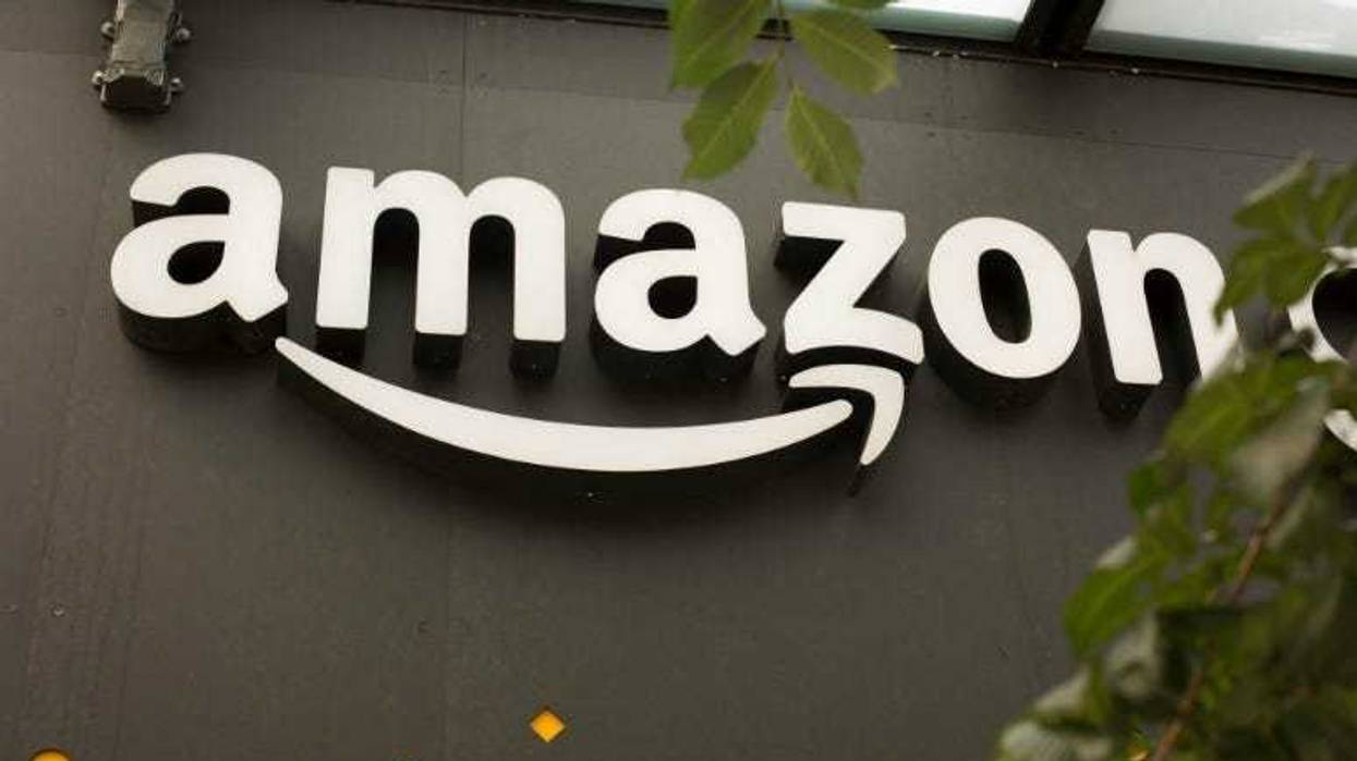 A portion of the sign advertising Amazon Go is seen outside the grocery store's location on June 16, 2017 in Seattle, Washington. Amazon announced that it will buy Whole Foods Market, Inc. for over $13 billion dollars.