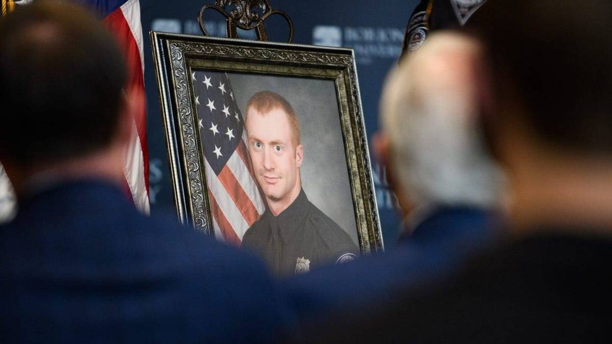 A portrait of former Greenville Police Department officer Allen Jacobs is visible during a memorial in honor of his life and service at Bob Jones University Thursday, March 18, 2021