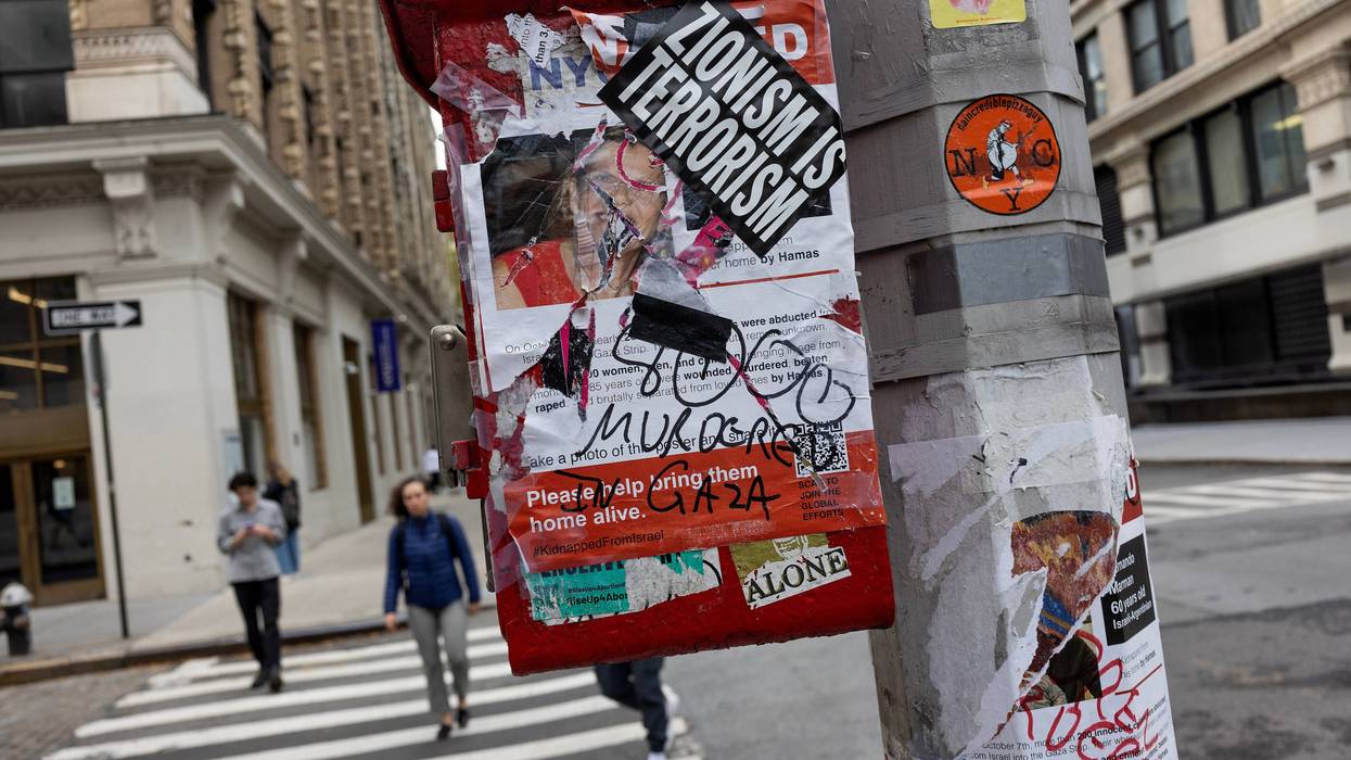 A poster for hostages kidnapped on Oct. 7, 2023, by Hamas in Israel is torn and covered with an anti-Israel sticker, Nov. 7, 2023, in New York City.