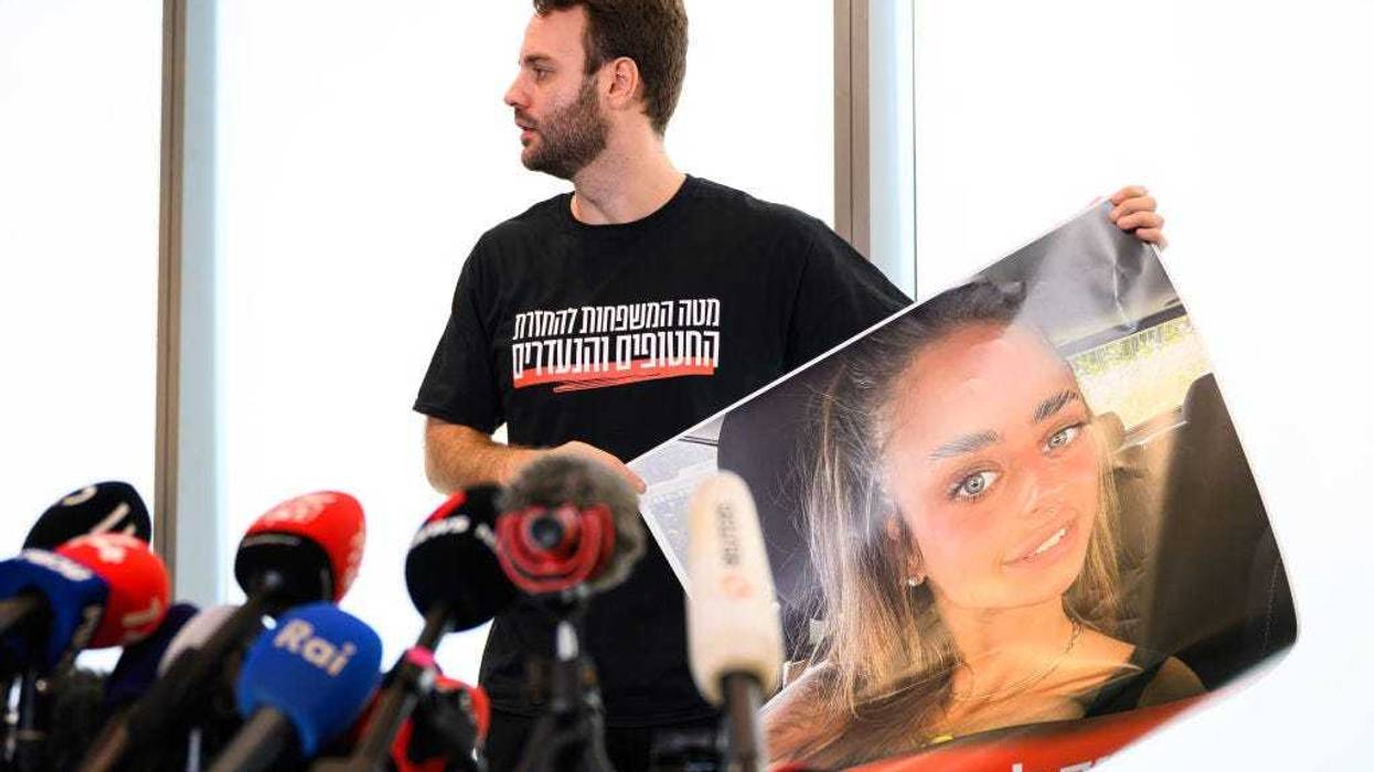 A poster of Mia Shem is displayed, during a press conference, following the release of new footage of the hostages taken by Hamas during their attack, October 17, 2023 in Tel Aviv, Israel. Ms Shem appears in the video, lying on a bed, while her arm is being bandaged. As Israel prepares to invade the Gaza Strip in its campaign to vanquish Hamas, the Palestinian militant group that launched a deadly attack in southern Israel on October 7th, worries are growing of a wider war with multiple fronts, including at the country's northern border with Lebanon. Countries have scrambled to evacuate their citizens from Israel, and Israel has begun relocating residents some communities on its northern border. Meanwhile, hundreds of thousands of residents of northern Gaza have fled to the southern part of the territory, following Israel's vow to launch a ground invasion. (Photo by Leon Neal/Getty Images)