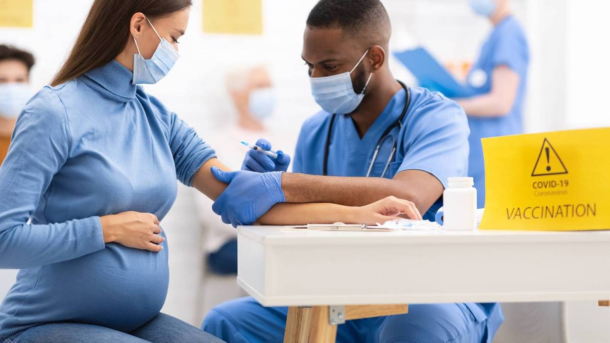A pregnant woman getting the COVID-19 shot.