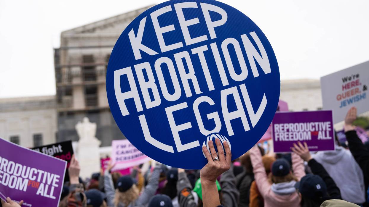 A pro-choice demonstrator holds a sign in front of the U.S. Supreme Court as the Medina v. Planned Parenthood South Atlantic case is heard on Wednesday, April 2, 2025.