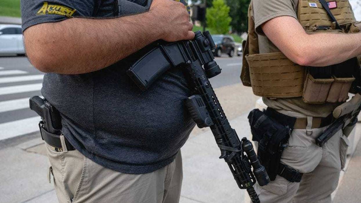 A pro-gun demonstrator sporting an AR-15 and a handgun is seen on the sidewalk outside after a special session is adjourned at the Tennessee State Capitol on August 21, 2023 in Nashville, Tennessee. Republican Tennessee Governor Bill Lee called for the special legislation session on public safety in response to public outcry after the The Covenant School mass shooting on March 27th, where three children and three staff were killed. (Photo by Jon Cherry/Getty Images)