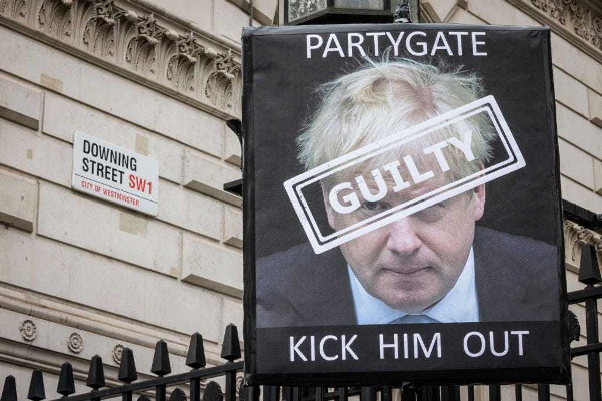 A protest sign is seen outside Downing Street on April 13, 2022 in London, England.