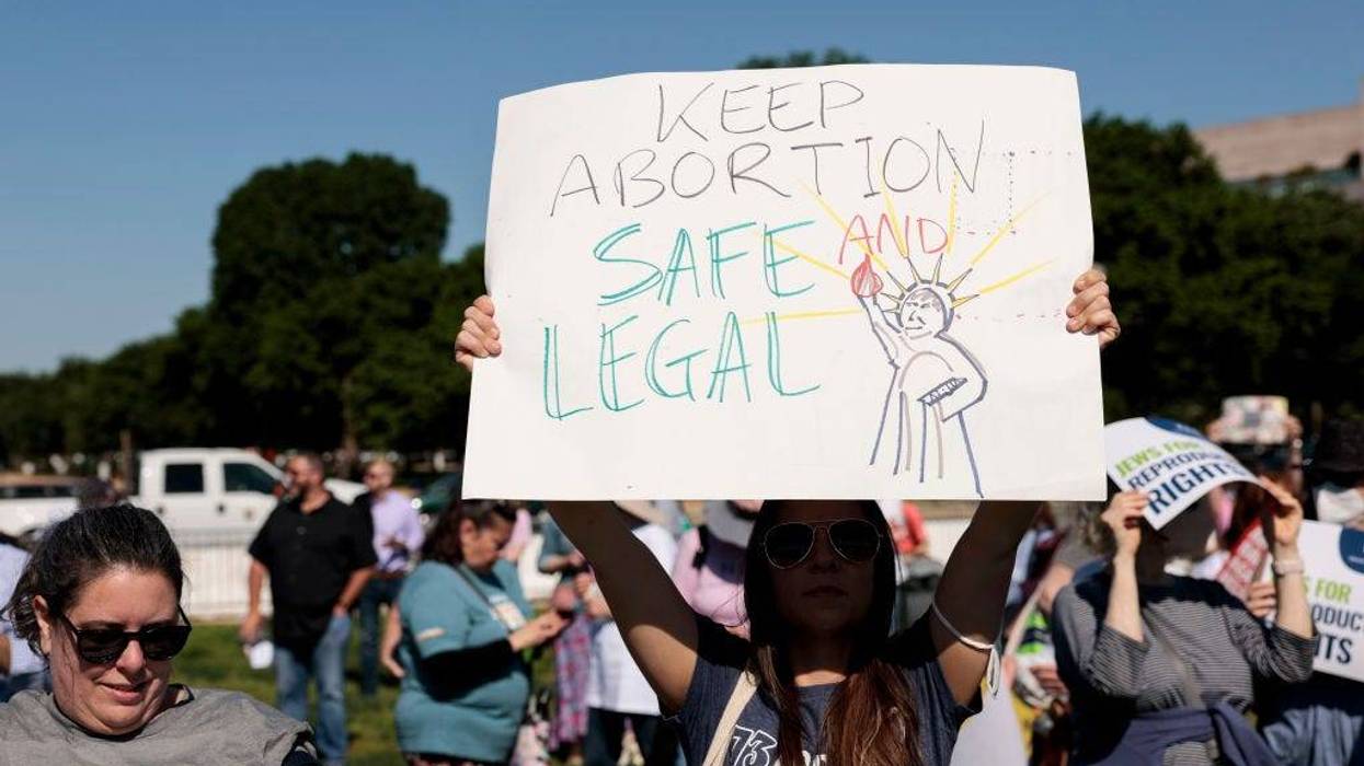 A protester carries a sign as they attend the "Jewish Rally for Abortion Justice" rally at Union Square near the U.S. Capitol on May 17, 2022 in Washington, DC.