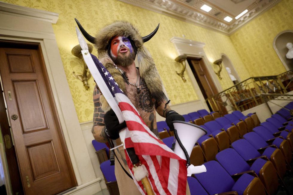 A protester yells inside the Senate Chamber on January 06, 2021 in Washington, DC. Congress held a joint session today to ratify President-elect Joe Biden