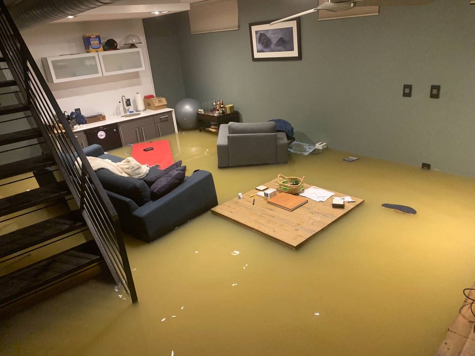 A Queen Village basement apartment is flooded after a water main break.
