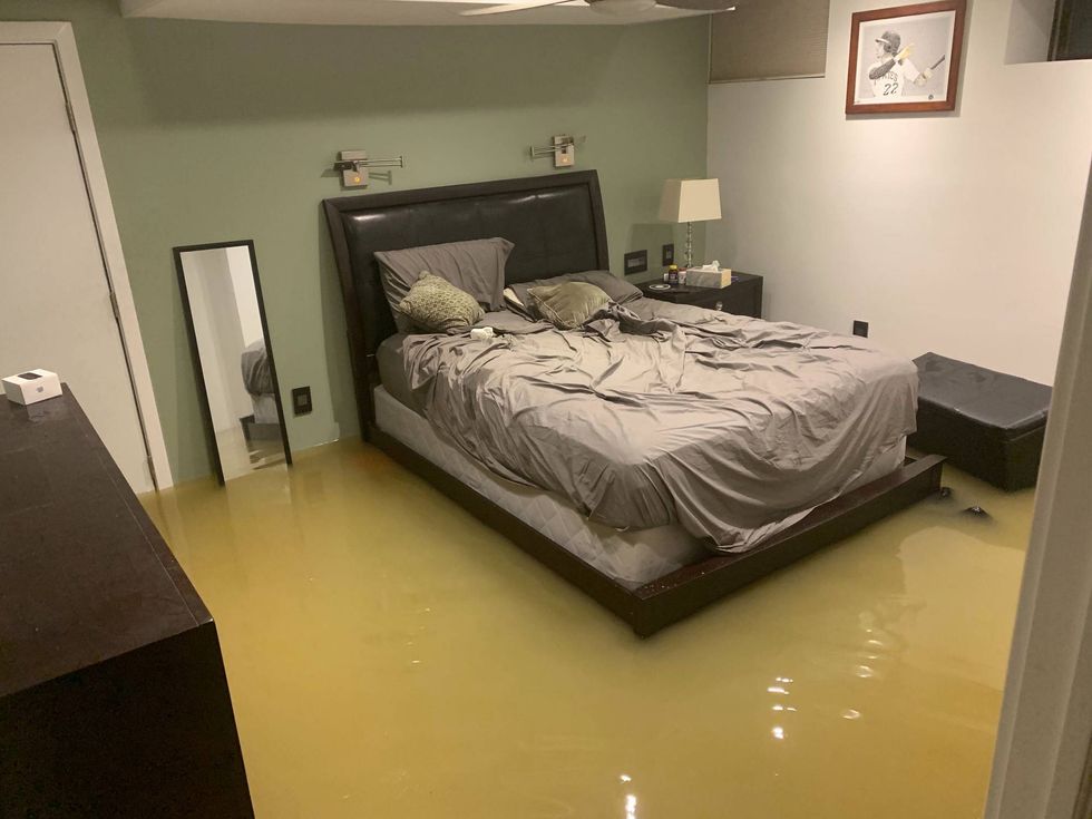 A Queen Village basement apartment is flooded after a water main break.