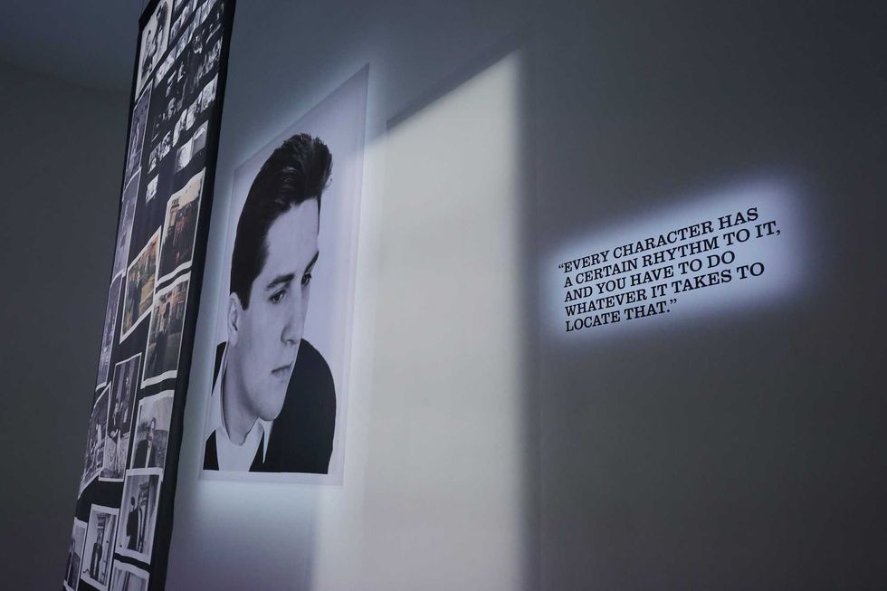 A quote from De Niro on the wall at De Niro Con, along with archival photos of the actor.