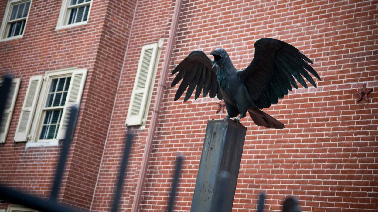 A Raven statue outside the home of Edgar Allen Poe, Famous American poet. The Raven was his most popular poem, the statue signifies that fact.