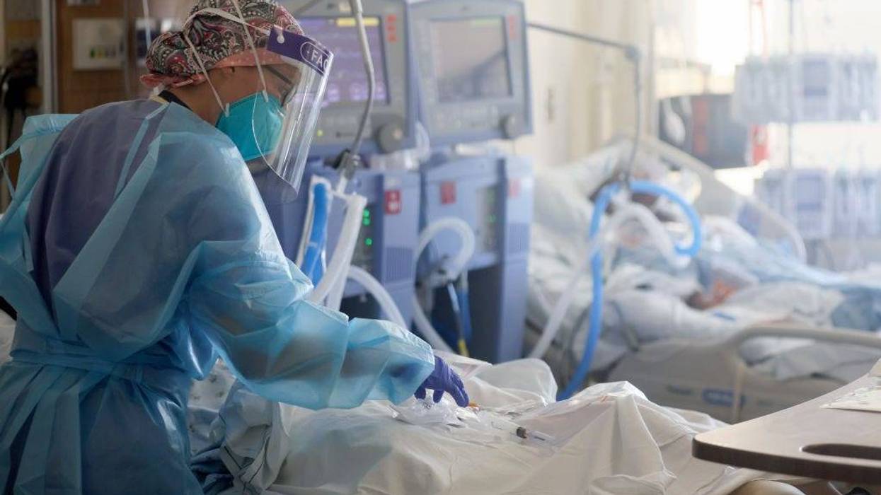A registered nurse, cares for COVID-19 patients in a makeshift ICU at Harbor-UCLA Medical Center on January 21, 2021 in Torrance, California.