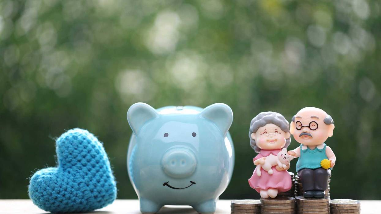 A retired couple and a piggy bank.