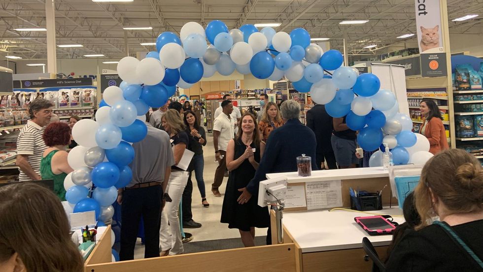 A ribbon cutting inside PetSmart in Northeast Philadelphia, where the newest Emancipet location opened.