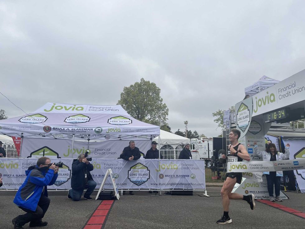 A runner making a "photo finish" at the Long Island Marathon.