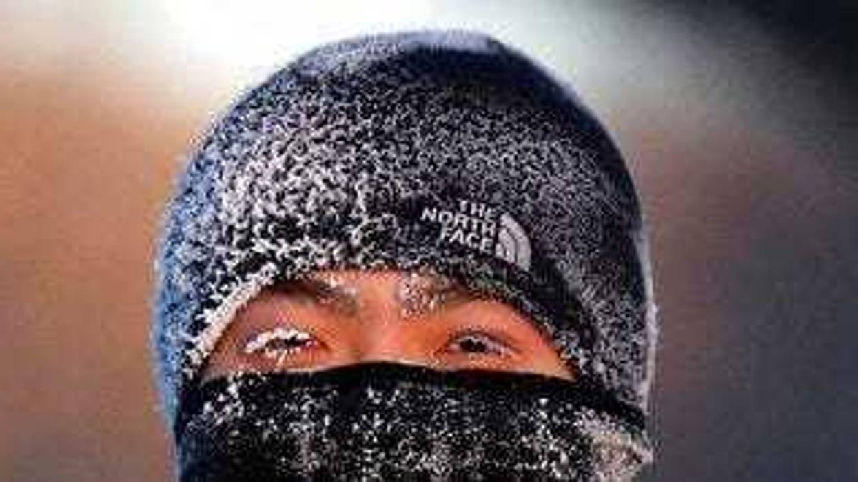 A runner wears the cold on his face while running along West River Parkway hills Thursday, Feb. 13, 2020, near downtown Minneapolis, with temperatures hovering near minus 30 degrees Fahrenheit with wind chills. (David Joles/Star Tribune via AP)