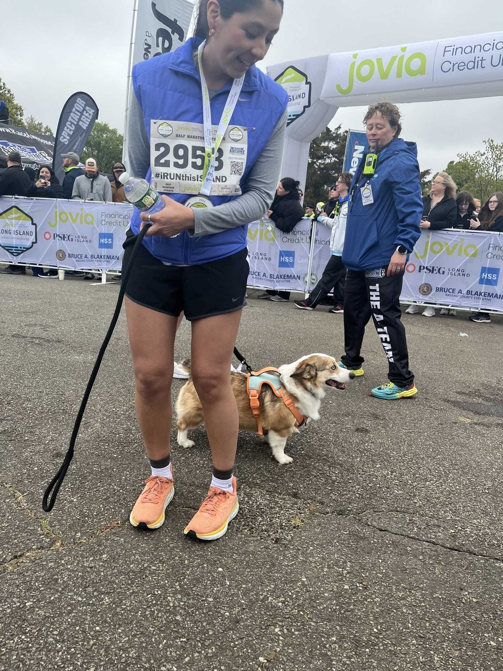 A runner who had her dog, Koda, take part in one mile of the race with her.
