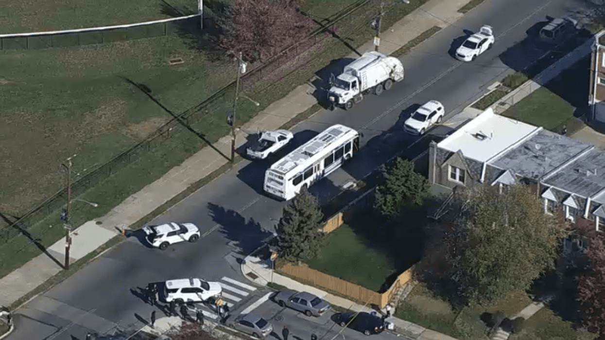 A sanitation truck is the scene of a homicide in Philadelphia's Mayfair section on Friday morning.