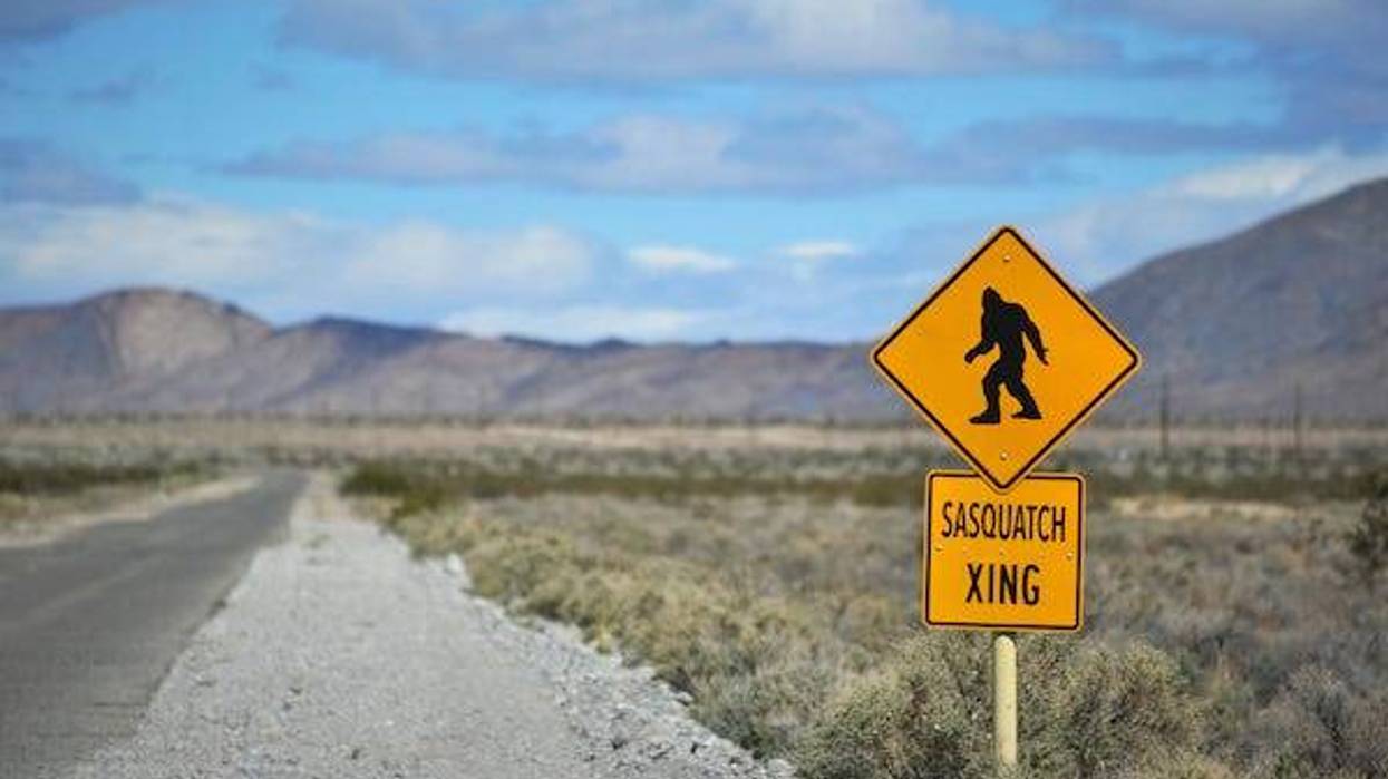 A Sasquatch crossing sign in the middle of the desert