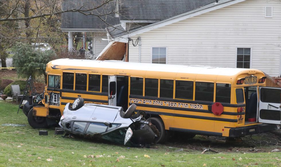 A school bus ran off of Southgate Drive in New Hempstead, hitting a parked minivan and crashed into a house Dec. 1, 2022.A school bus ran off of Southgate Drive in New Hempstead, hitting a parked minivan and crashed into a house Dec. 1, 2022.