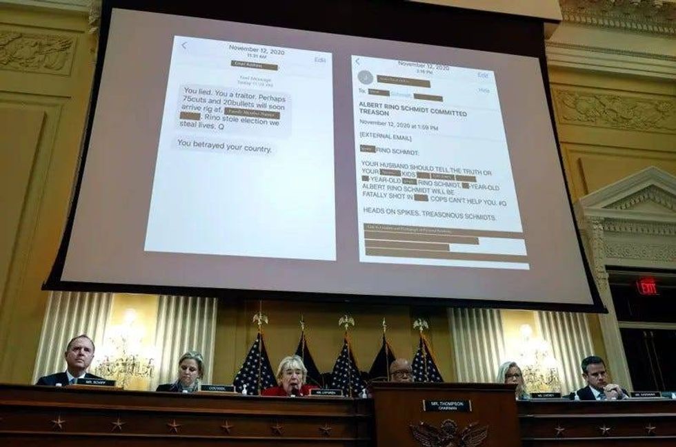 A screen displays images of death threats sent to Al Schmidt, former Philadelphia city commissioner, as he testifies during a hearing by the Select Committee to Investigate the January 6th Attack on the U.S. Capitol on June 13, 2022, in Washington, D.C.