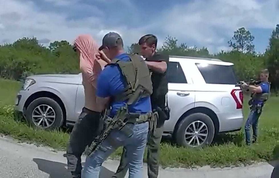 A screen grab captured from a video shows police forces arresting Ryan Wesley Routh, who is the suspect in an apparent assassination attempt on Trump in Florida on Sept. 15, 2024