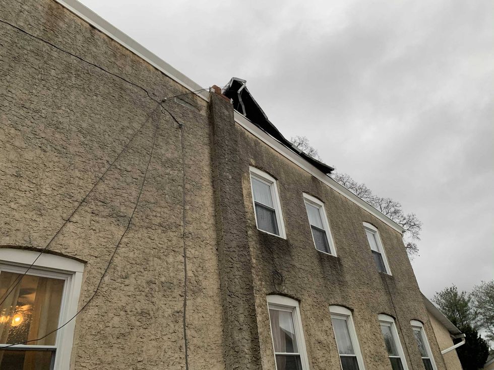 A section of roof on this house was badly damaged in Thursday night