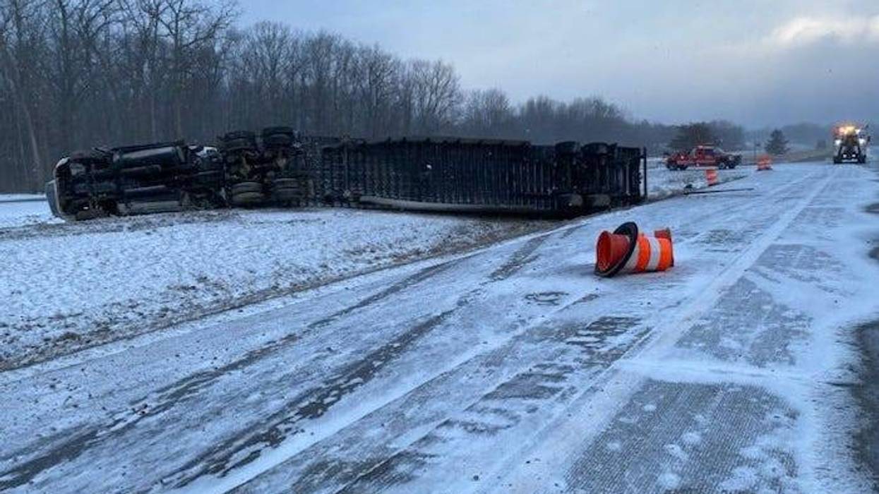 A semi truck that flipped over and closed down both directions of I-69 on Saturday was discovered hauling "dangerous goods," authorities in Lapeer announced.