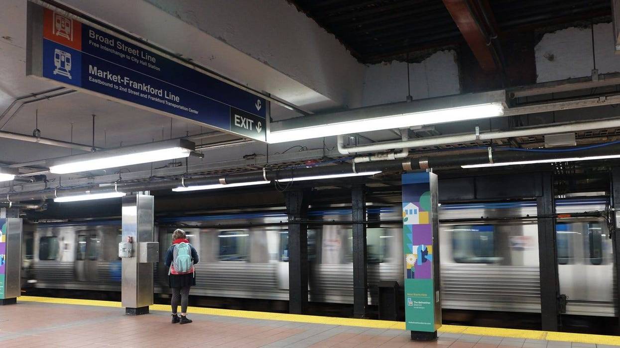 A SEPTA rider waits for the Market-Frankford Line subway at the 15th Street platform.
