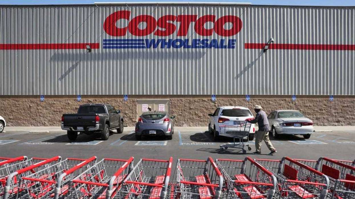 A shopper walks in front of a Costco store on February 25, 2021 in Inglewood, California.