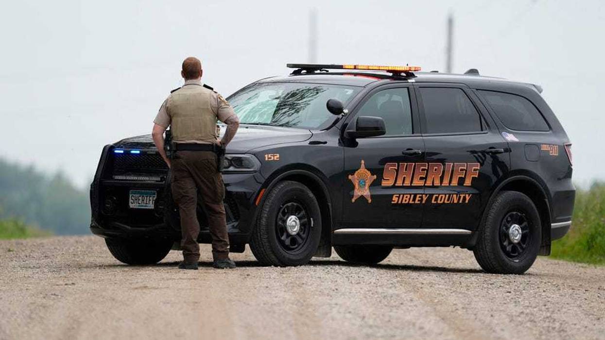 A Sibley County Sheriff's Deputy blocks the road where the suspect involved in the shooting of two state lawmakers vehicle was found Sunday, June 15, 2025, in Faxon Township, Minn.