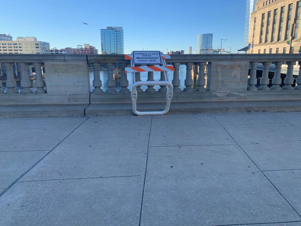 A sidewalk closure sign on the Market Street Bridge near 30th Street Station.