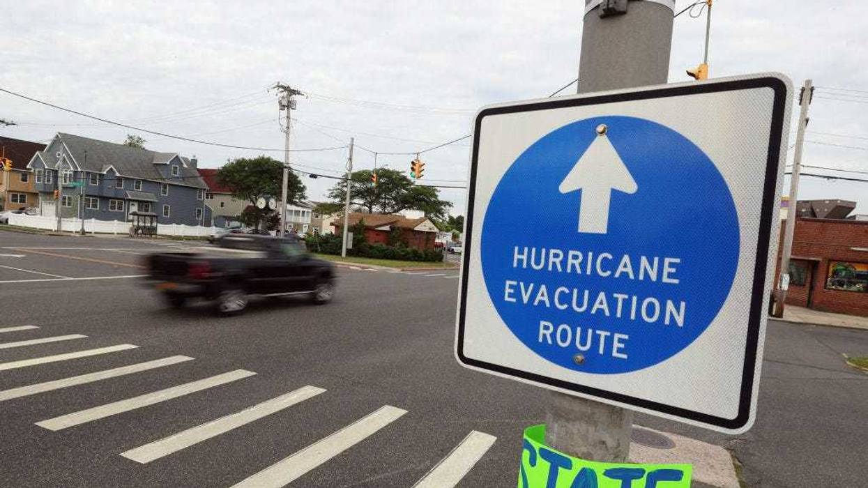 A sign alerts drivers to the hurricane evacuation site as Hurricane Henri moves towards Long Island on August 21, 2021 in Long Beach, New York. A storm surge, hurricane conditions and flooding are expected along the northeastern coast of the United States beginning late Saturday night and into midday Sunday.