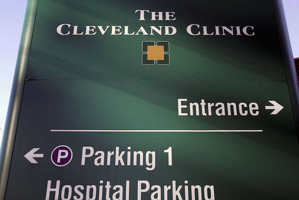A sign directing visitors to the emergency room stands outside The Cleveland Clinic in Cleveland, Ohio.
