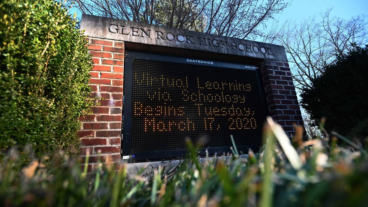 A sign displays the message that Glen Rock High School will transition to virtual learning starting Tuesday, March 17 as the coronavirus continues to spread across the United States on March 15, 2020 in Glen Rock, New Jersey.