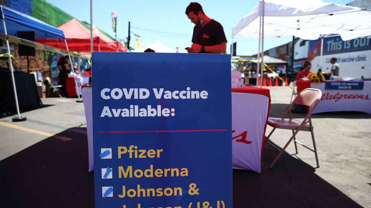 A sign displays the types of COVID-19 vaccination doses available at a Walgreens mobile bus clinic on June 25, 2021 in Los Angeles, California.