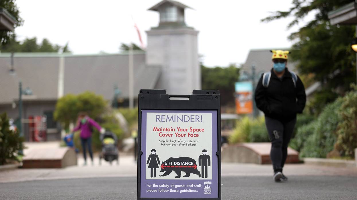 A sign encouraging social distancing are displayed at the San Francisco Zoo & Gardens on July 13, 2020 in San Francisco, California.