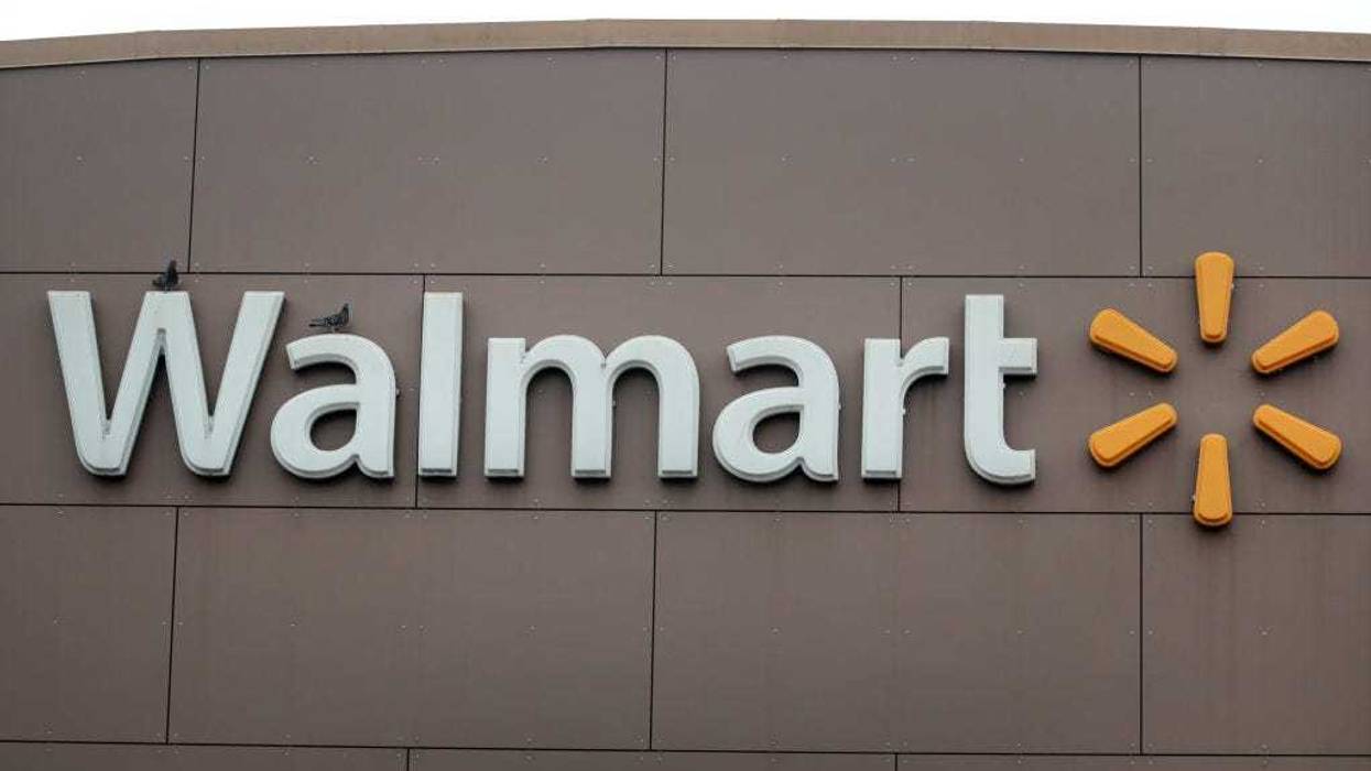 A sign hangs outside of a Walmart store on May 19, 2020 in Chicago, Illinois.