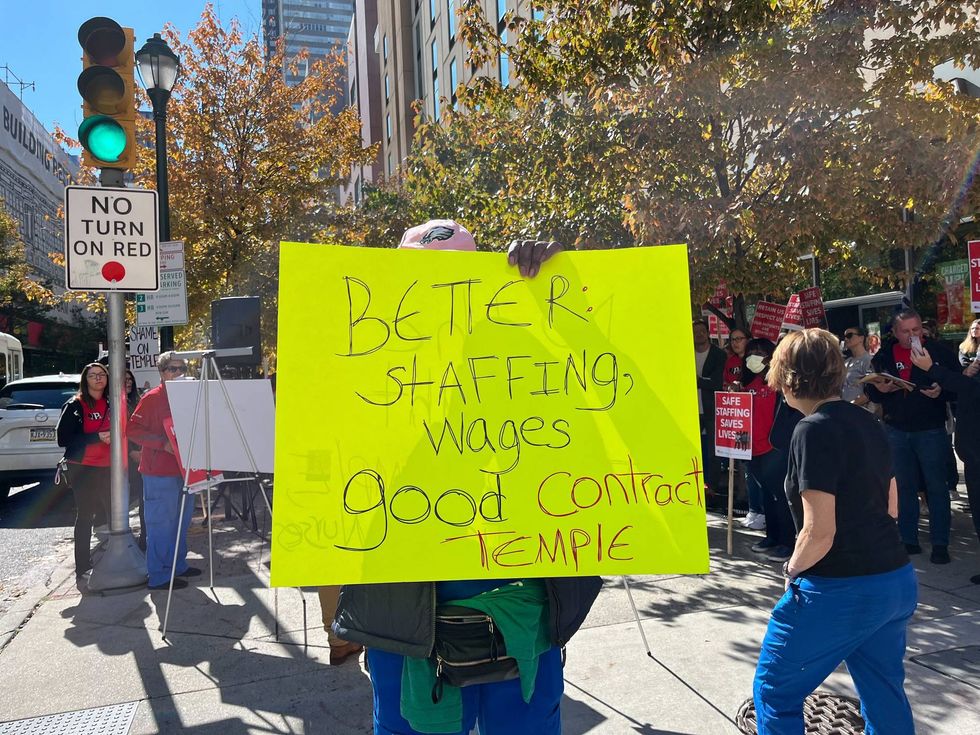 A sign held by a participant in a march for Temple University Hospital workers in support of their demands during contract negotiations. Their demonstration was held outside the Pennsylvania Convention Center on Friday.