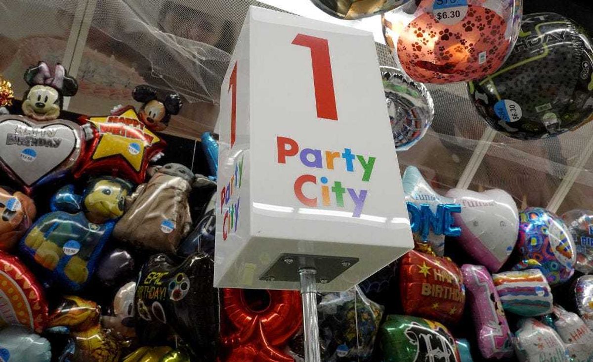 A sign in a Party City store