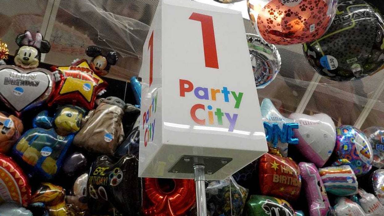 A sign in a Party City store